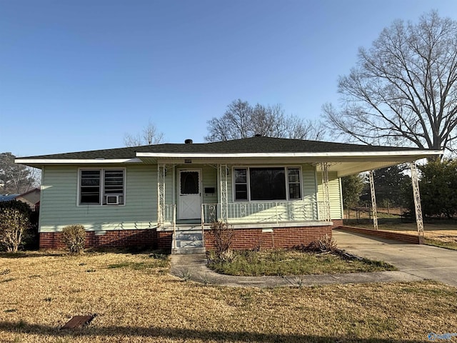 view of front facade with crawl space, covered porch, an attached carport, and concrete driveway