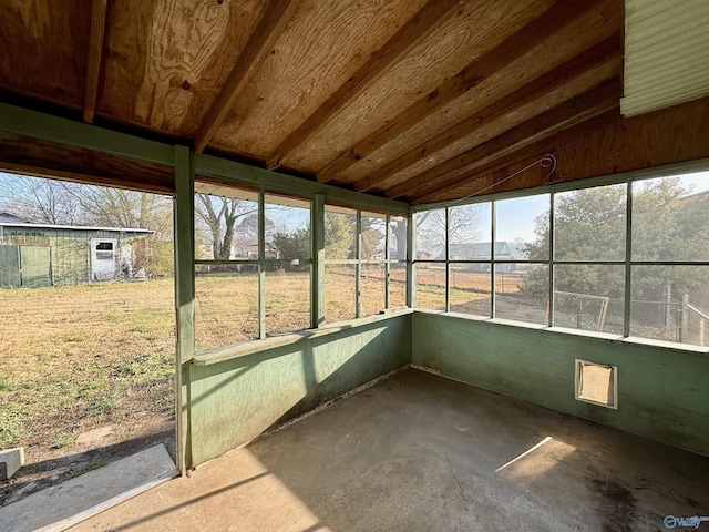 unfurnished sunroom with vaulted ceiling