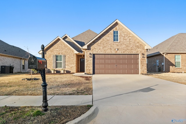 view of front of property with central air condition unit, brick siding, driveway, and a shingled roof