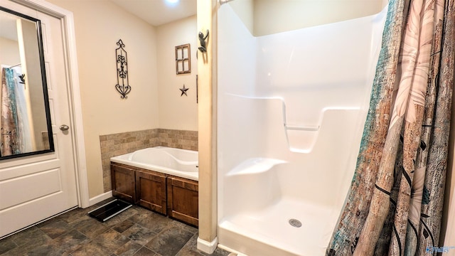 full bathroom with visible vents, baseboards, a stall shower, and a bath