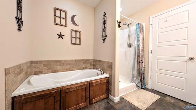 full bathroom featuring a stall shower and a bath