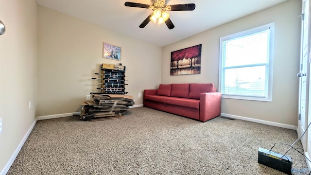 living area featuring visible vents, ceiling fan, carpet, and baseboards