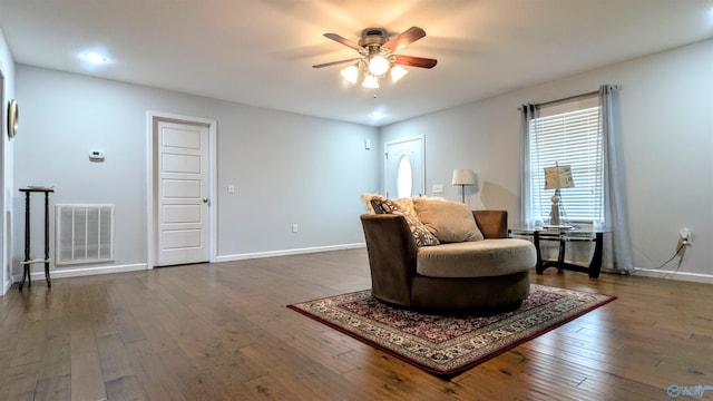 sitting room featuring dark wood-style floors, a ceiling fan, visible vents, baseboards, and recessed lighting