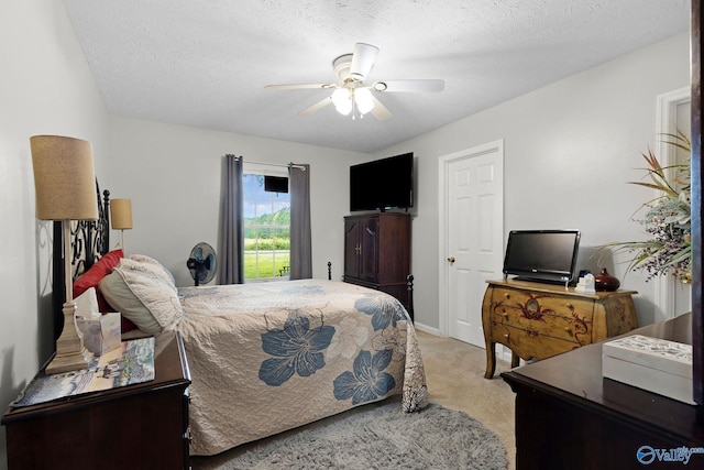 14249 Parker Rd, Athens, AL 35611 - bedroom featuring light colored carpet, ceiling fan, and a textured ceiling