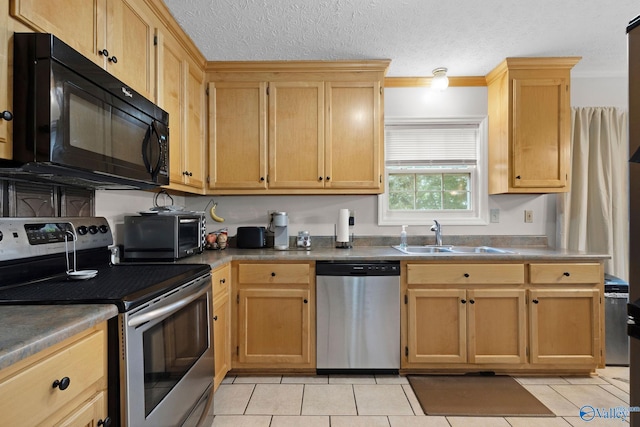 14249 Parker Rd, Athens, AL 35611 - kitchen with appliances with stainless steel finishes, a sink, light tile patterned floors, and a textured ceiling