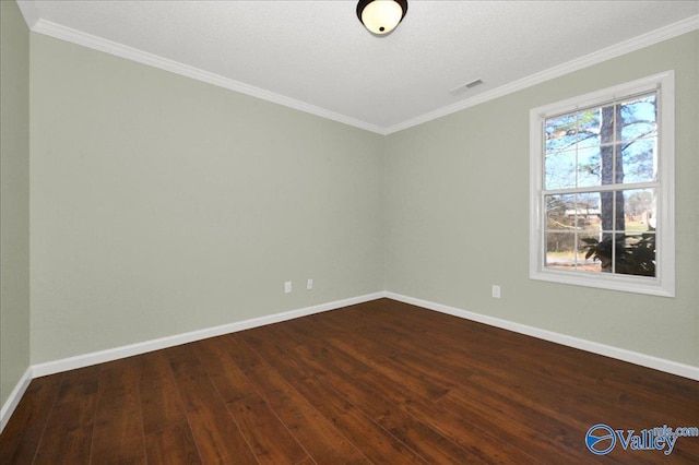 unfurnished room featuring ornamental molding and dark wood-type flooring