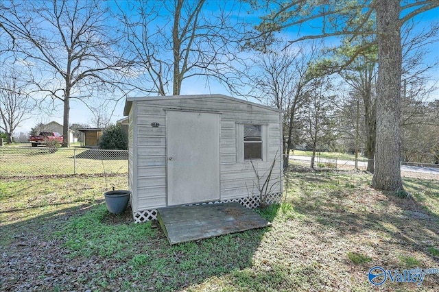 view of outbuilding featuring a lawn