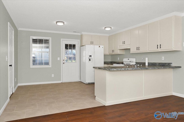 kitchen featuring range, wood-type flooring, white refrigerator with ice dispenser, kitchen peninsula, and dark stone counters