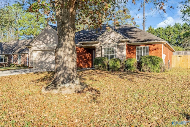 ranch-style house with a front yard and a garage