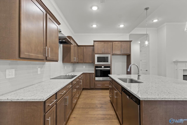 kitchen with sink, dishwasher, light stone counters, wall oven, and built in microwave