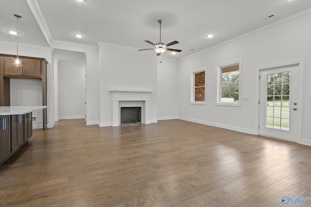 unfurnished living room featuring ornamental molding, dark hardwood / wood-style floors, and ceiling fan