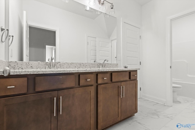 full bathroom with vanity, tub / shower combination, and toilet