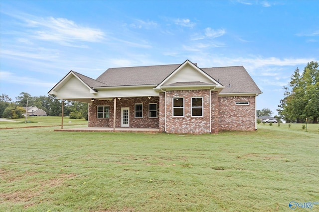 view of front facade with a patio area and a front lawn