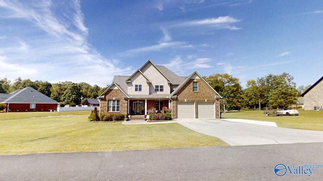 view of front of home with a garage and a front lawn