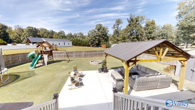 view of yard with a patio, an outdoor living space with a fire pit, a gazebo, and a playground