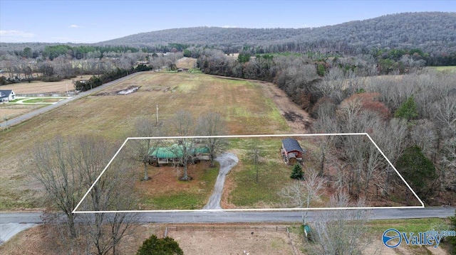 drone / aerial view featuring a rural view and a mountain view