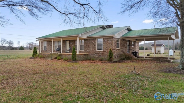 view of front of house with a front lawn and a porch