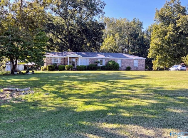 ranch-style house with a front lawn