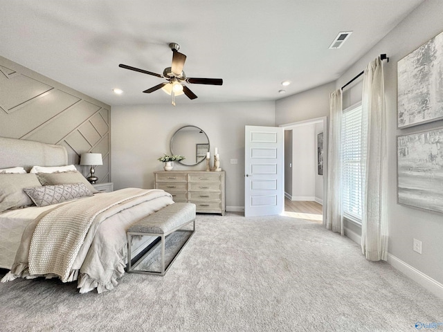 bedroom with light carpet and ceiling fan