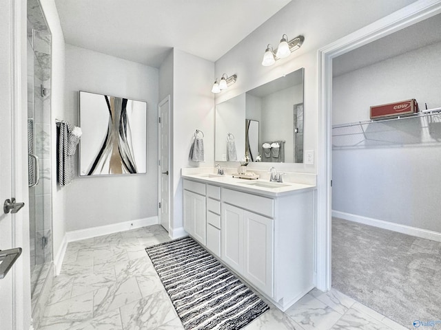 bathroom featuring vanity and an enclosed shower