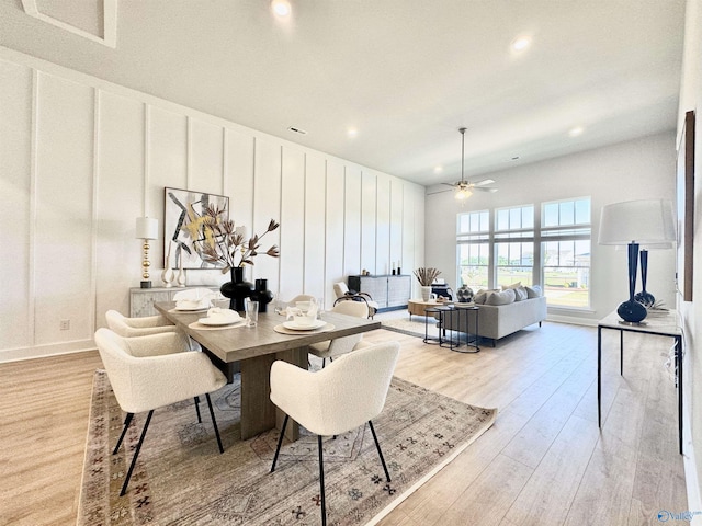 dining space featuring light wood-type flooring and ceiling fan