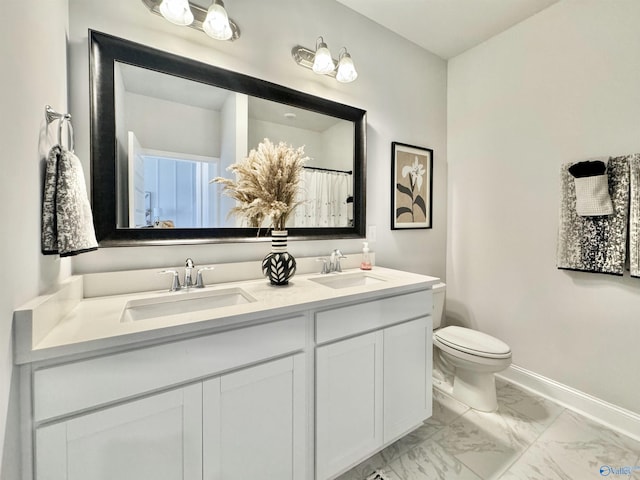 bathroom featuring vanity and toilet