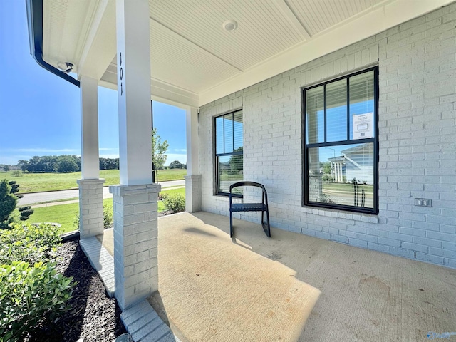 view of patio featuring a porch