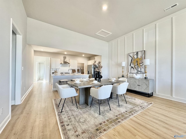 dining room featuring light hardwood / wood-style flooring