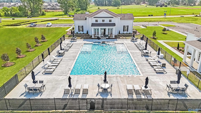 view of pool with french doors and a patio area