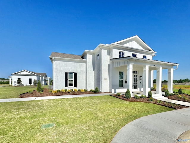 view of front of home featuring a front lawn and covered porch