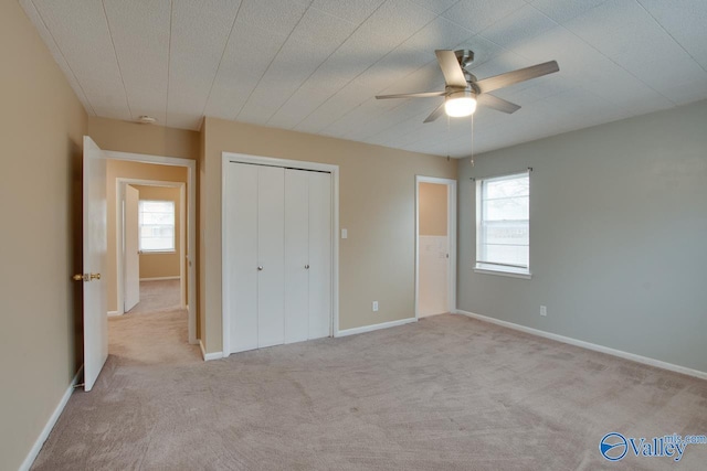 8201 Willowbrook Cir Unit B, Huntsville, AL 35802 - unfurnished bedroom with carpet, a closet, a ceiling fan, and baseboards