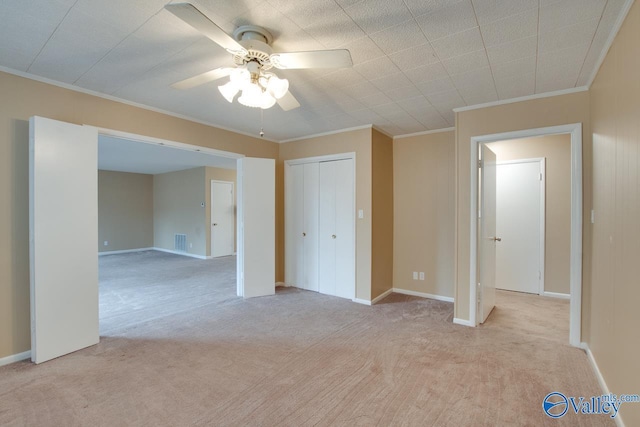 8201 Willowbrook Cir Unit B, Huntsville, AL 35802 - unfurnished bedroom with light colored carpet, crown molding, a closet, baseboards, and ceiling fan