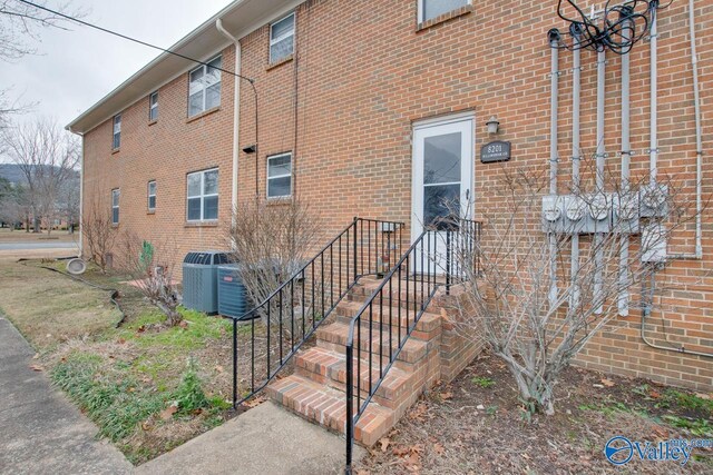 8201 Willowbrook Cir Unit B, Huntsville, AL 35802 - property entrance with central AC and brick siding