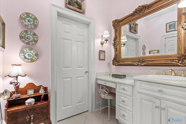 bathroom featuring baseboards, vanity, and tile patterned floors