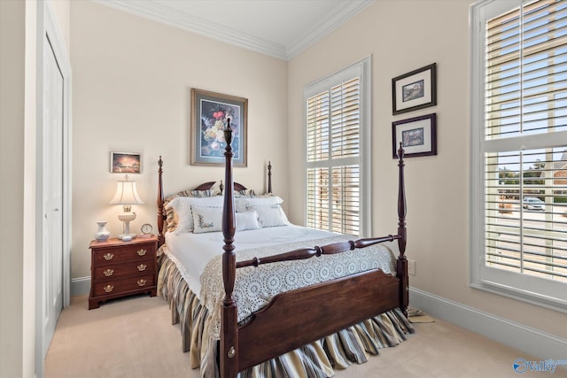 bedroom featuring light carpet, ornamental molding, and baseboards