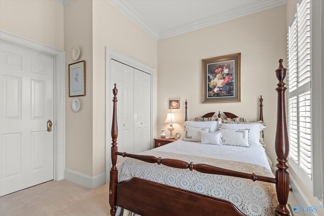 bedroom with light carpet, a closet, baseboards, and crown molding