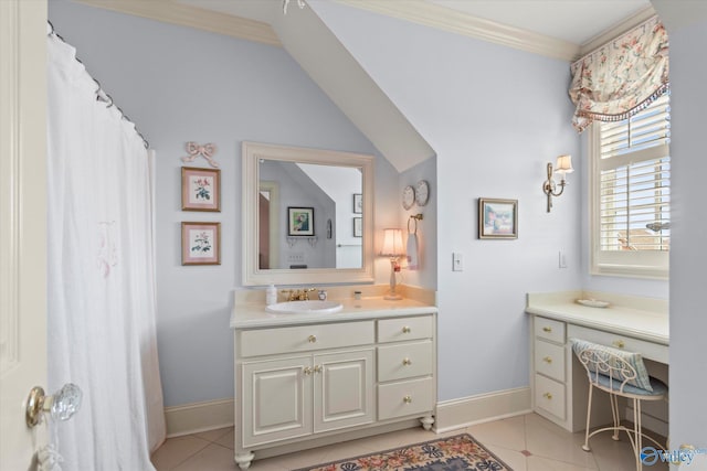 bathroom featuring ornamental molding, vanity, baseboards, and tile patterned floors