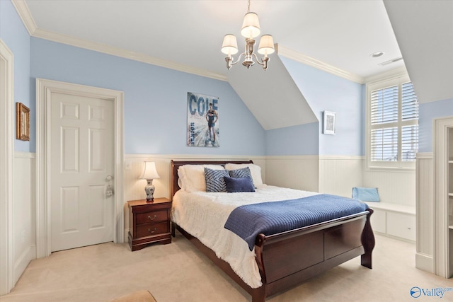 bedroom with a wainscoted wall, light carpet, crown molding, and visible vents