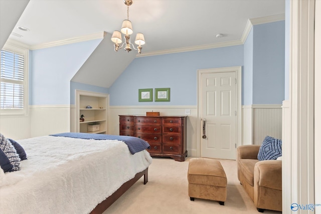 carpeted bedroom featuring a wainscoted wall, an inviting chandelier, and crown molding