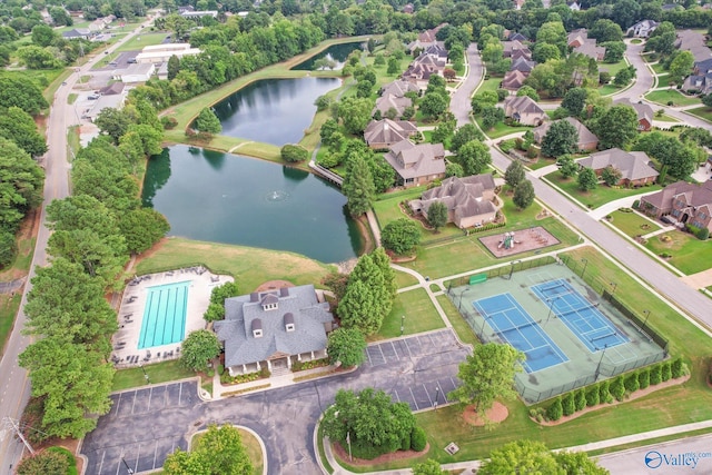 bird's eye view with a water view and a residential view