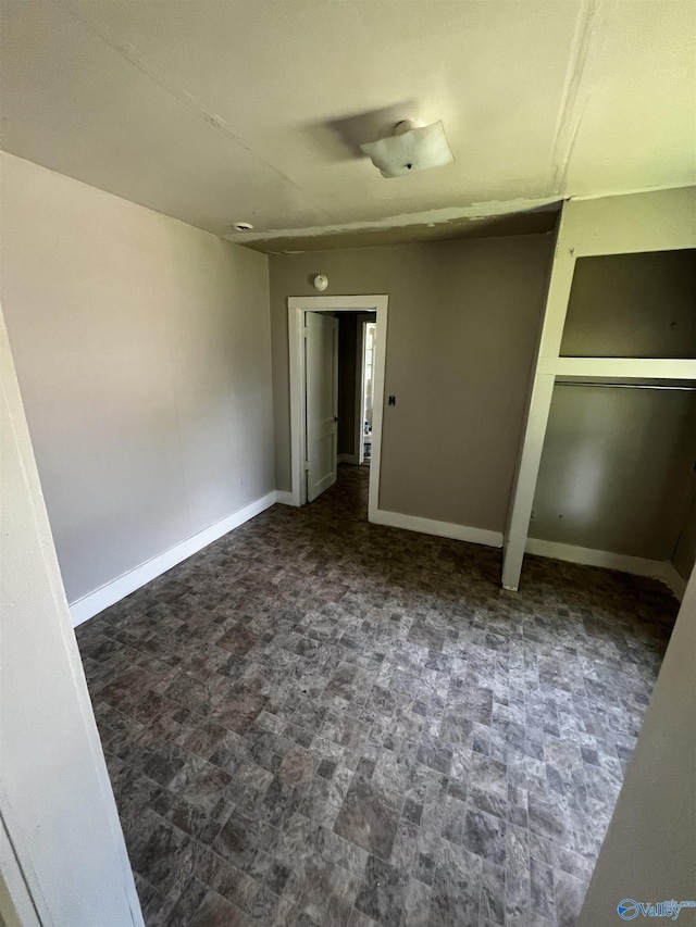 unfurnished bedroom featuring baseboards