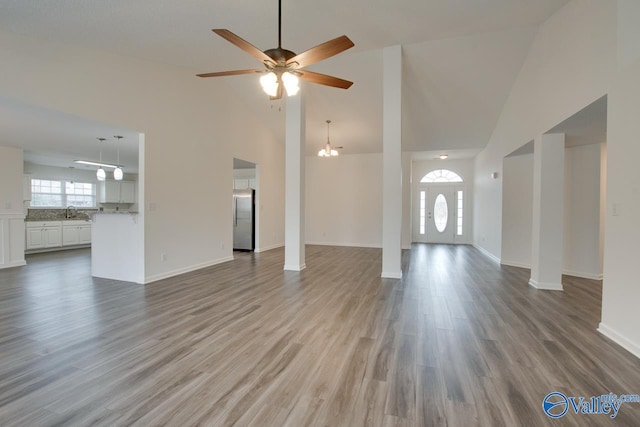 unfurnished living room featuring light wood-style flooring and baseboards