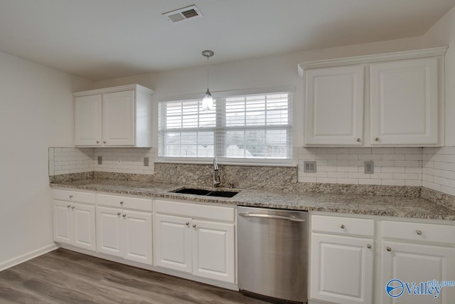 kitchen with a sink, visible vents, white cabinetry, and dishwasher