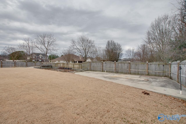 view of yard featuring a patio and a fenced backyard