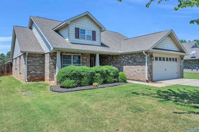 view of front of property with a front yard and a garage