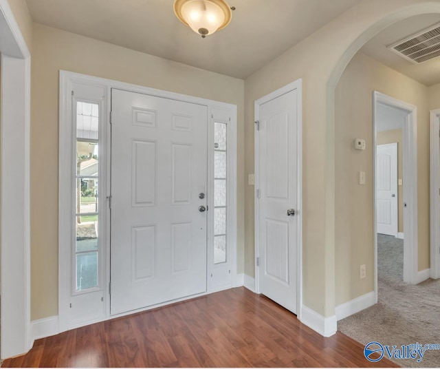 foyer with dark hardwood / wood-style flooring