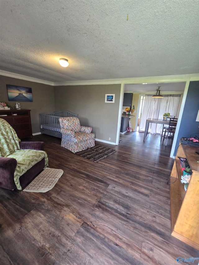 bedroom with a textured ceiling, dark hardwood / wood-style floors, and ornamental molding