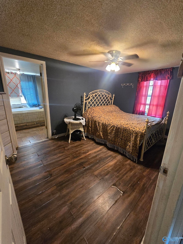 bedroom with a textured ceiling, hardwood / wood-style flooring, and ceiling fan