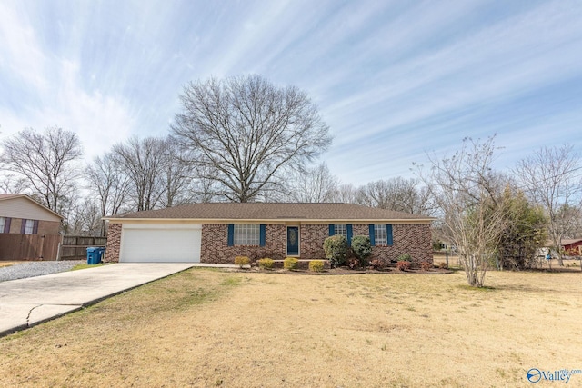 single story home featuring fence, driveway, an attached garage, a front lawn, and brick siding