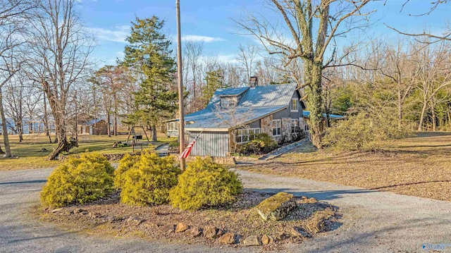 rustic home with driveway